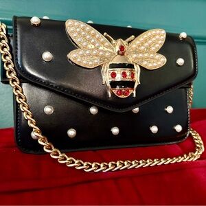 Elegant Black and Gold Handbag with Pearl Accents